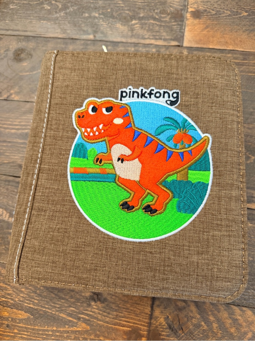 Pinkfong My First Book T-Rex, a Montessori-inspired interactive fabric busy book